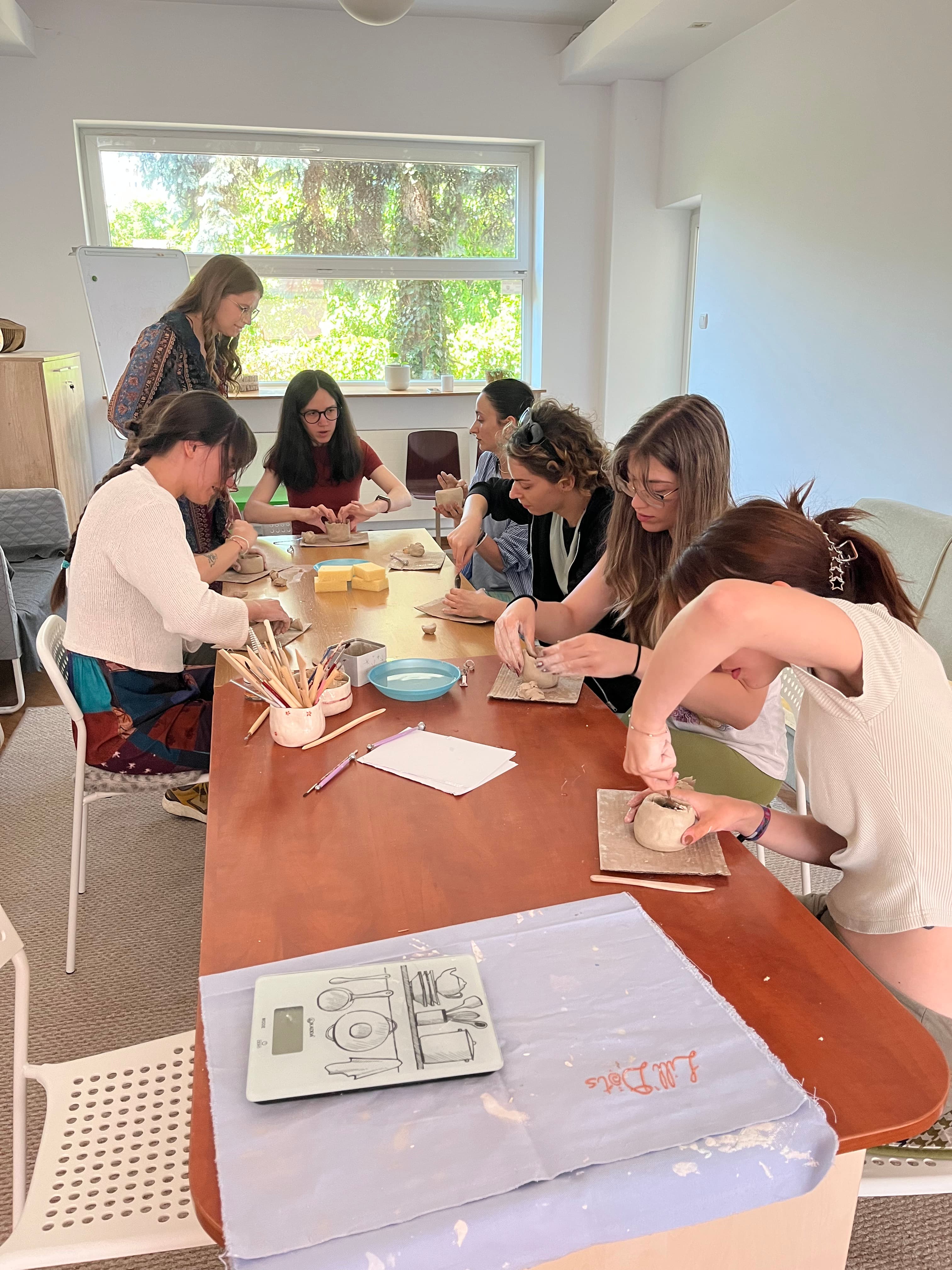 Close-up of hands shaping clay on a pottery wheel